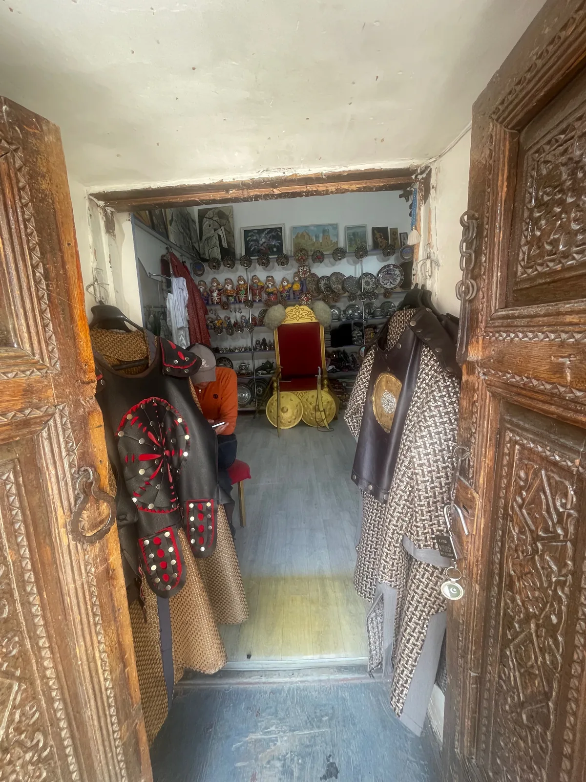 Souvenir swords and shields inside a former student cell